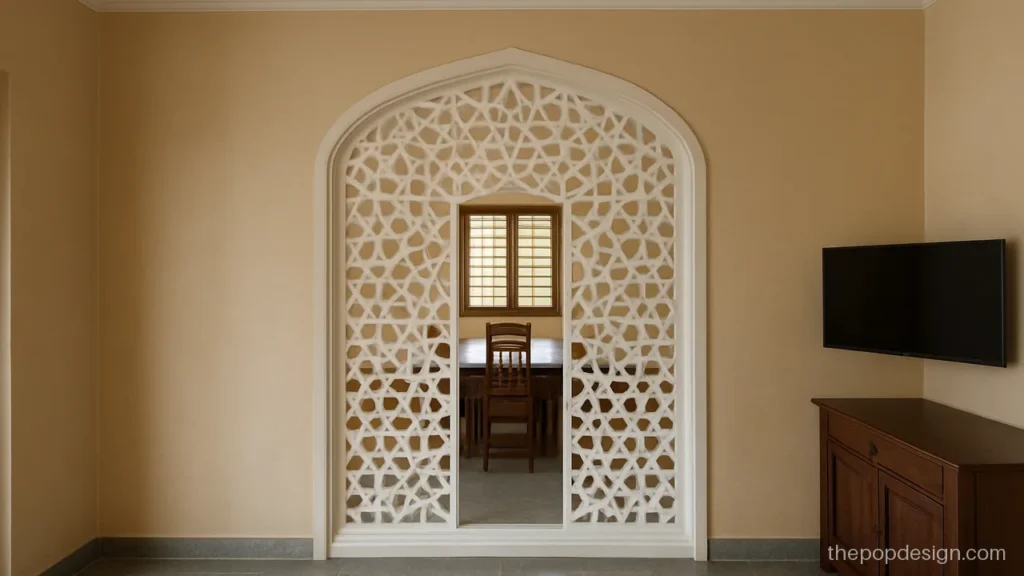 Pop jali design partition between hall and dining with geometric cut-outs